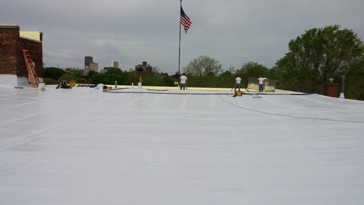 Large metal roof restored with a seamless waterproof membrane